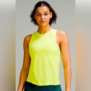 Brand new with tags Lululemon electric lemon tank. Size 4 never worn.